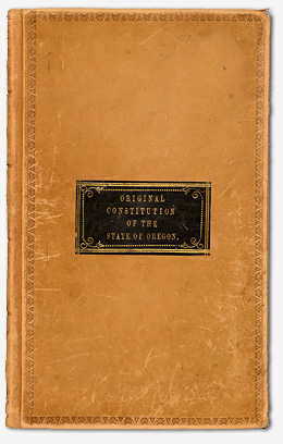 Leather cover with the title Original Constitution of the State of Oregon printed on the front.
