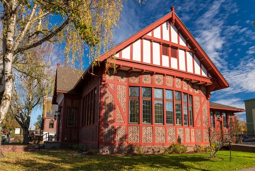 Building in the English Tudor Revival style. Originally Gresham's 1st public library. It features herringbone brickwork and leaded glass windows