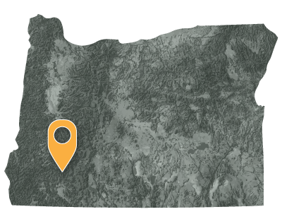 Oregon map with pointer showing the location of the Cow Creek Band in the southwestern quadrant.