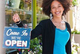 Woman holding Open sign