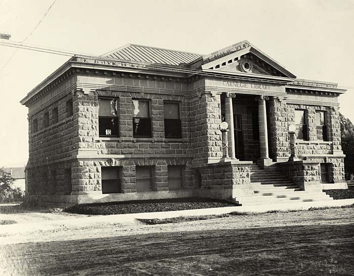 The Carnegie public library, a stone building in modified classical revival design.