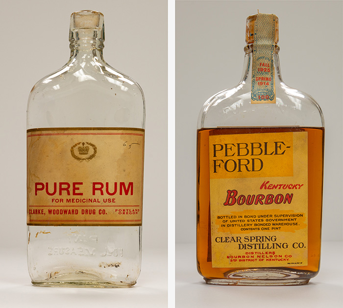 Clear glass bottles with labels reading: Pure Rum, for medicinal use. Pebble-Ford, Kentucky Bourbon, Clear Spring Distilling Co.