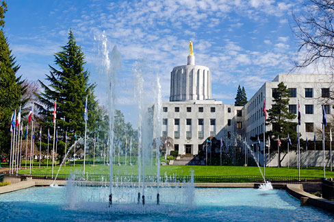 Oregon Capitol building with fountain in front.