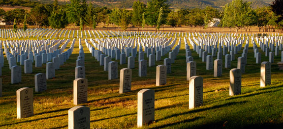 Hundreds of headstones marking graves in a cemetery.
