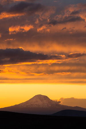 Mountain with yellow and orange sunset
