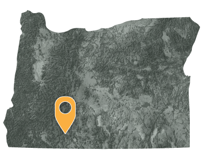 Oregon map with black and white circles documenting location of the Klamath Tribe