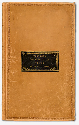 Leather cover with the title "Original Constitution of the State of Oregon" printed on the front.