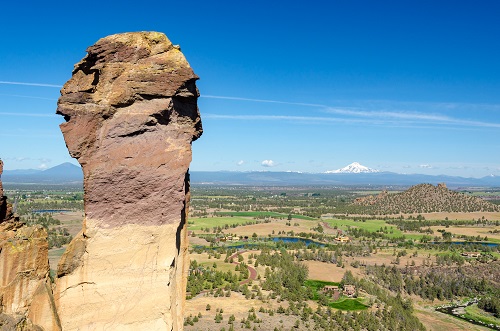 rock formation at Smith Rock State Park with river and mountain in background